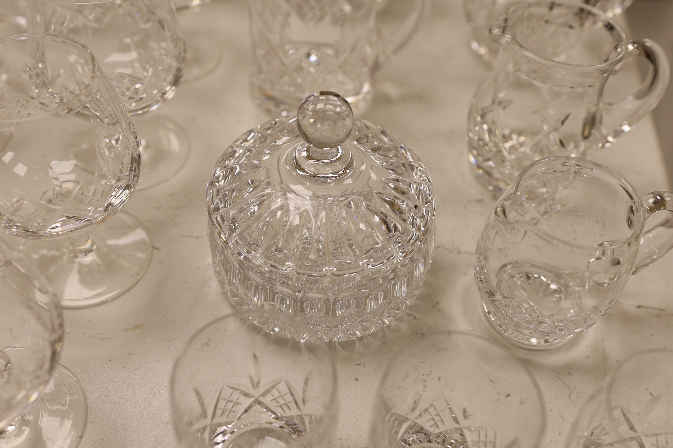 A large collection of suites of mostly Stuart cut glass, including, wine glasses, spirits glasses and jugs